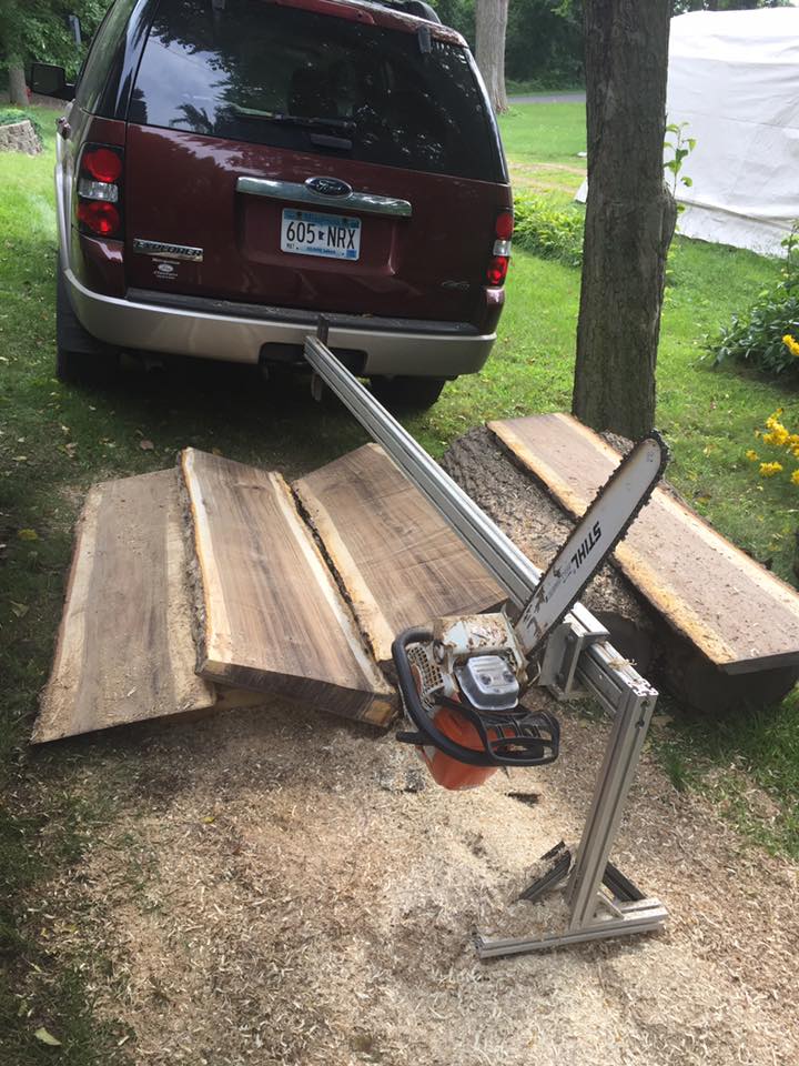 Homemade receiver hitch, ball bearing, portable chain saw mill with walnut