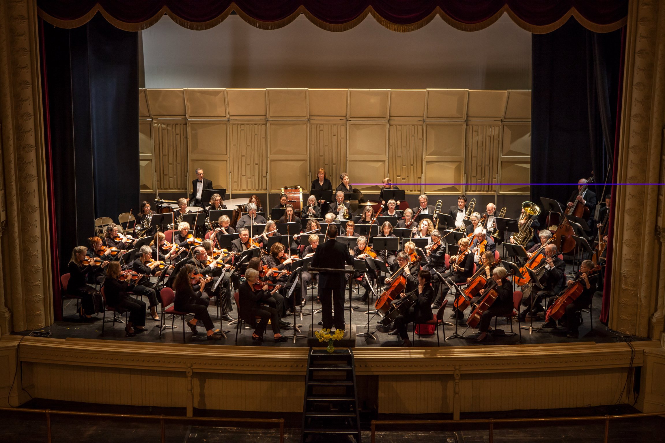 Vermont Philharmonic orchestra performing on stage at Barre Opera House